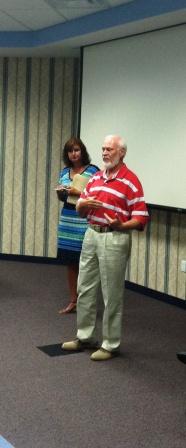 RCCS Board members Jim Kulig and Dr. Michelle Kowalski discuss plans for an employee survey this morning at the agency.